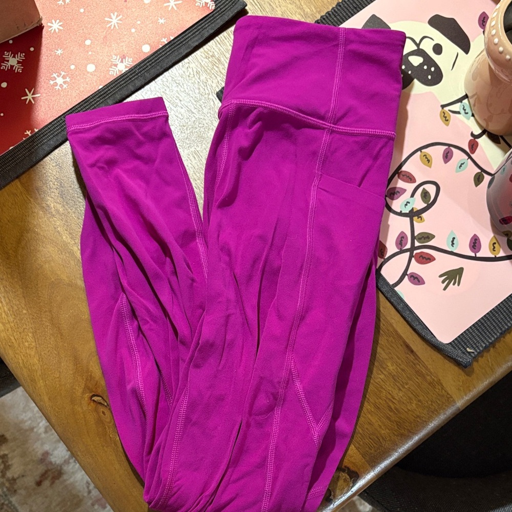 Athleta Magenta Stash Pocket Salutation Leggings